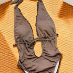 The ultimate beach show stopper Glittering Chocolate brown plunge swimsuit with ruffle accents